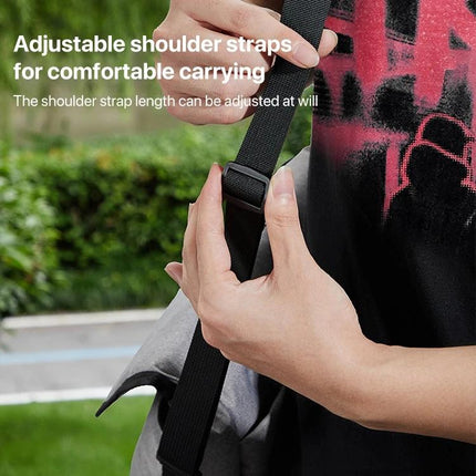 Baona Waterproof Camera Shoulder Bag for Everyday Use showing adjustable shoulder strap and hands adjusting buckle