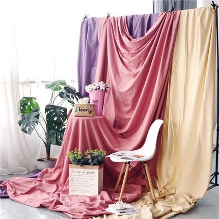 Solid Color Background Cloth for Photography, 1x2.4m Size draped pink backdrop with chair and props in studio setting
