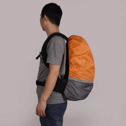 Alt Tag: Luminous Backpack Rain Cover for Outdoor Activities, Multiple Sizes on hiker with orange reflective cover protecting backpack from rain and elements