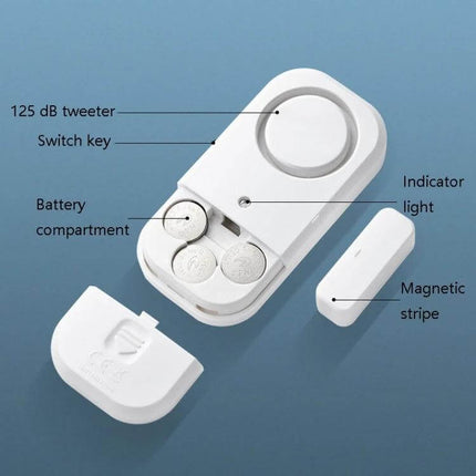 Wireless Magnetic Alarm for Home Door and Window Security - white wireless magnetic alarm with 125 dB tweeter, indicator light, battery compartment and magnetic stripe