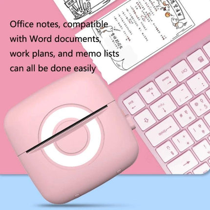 Portable Mini Printer for Student Notes, Photos, and Memos - pink inkless thermal mini printer beside keyboard printing notes
