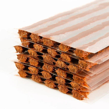 Rubber Strips for Quick Tire Fixes on Road Trips - stacked brown self-adhesive repair strips for temporary tire puncture repairs