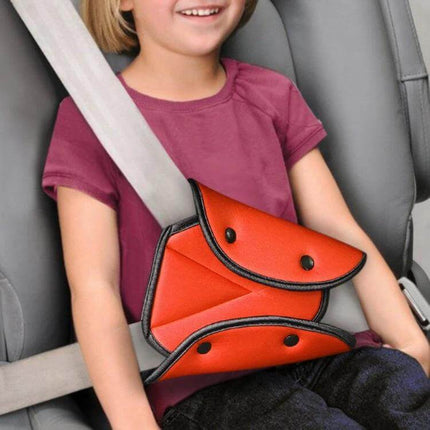 Car Seat Belt Cover Triangle Design for Child Comfort - orange triangle seat belt fixator positioned to keep belt off a smiling child’s neck