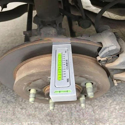 Magnetic Tool for Everyday Vehicle Alignment and Maintenance attached to brake wheel showing camber adjustment on a vehicle rotor