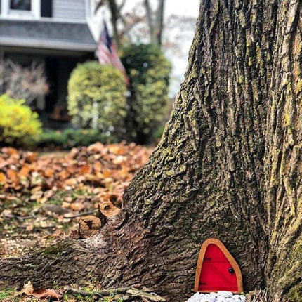 Courtyard Wooden Miniature Fairy Door For Garden Decor red miniature door at tree base in autumn garden scene, fits planters and terrariums