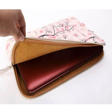 LiSEN Protective Bag for 10 to 15 Inch Notebooks and Tablets — floral zip sleeve showing padded interior protecting a red laptop