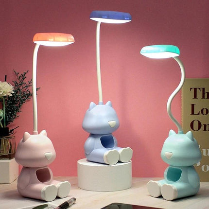 Cartoon Desk Lamp with Pen Holder for Student Study Sessions showing three colorful bendable silicone lamps with pen holders on a study desk
