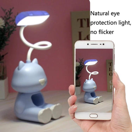 Cartoon Desk Lamp with Pen Holder for Student Study Sessions showing bendable silicone arm illuminating notes and holding pens