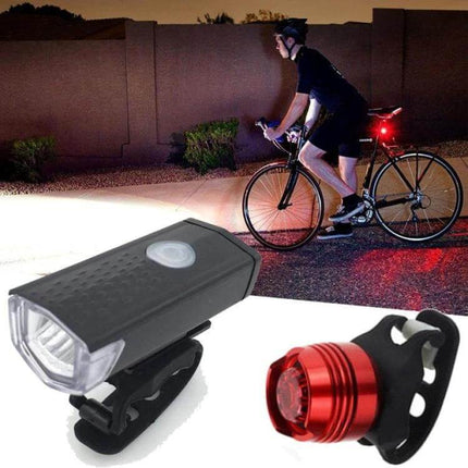 Bicycle Headlight and Taillight Set USB Rechargeable showing compact CREE XPE 3W front light and red taillight on urban night ride