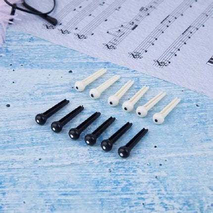 Plastic Conical Pins for Everyday Guitar String Maintenance — set of black and white ABS bridge pins securing acoustic guitar strings
