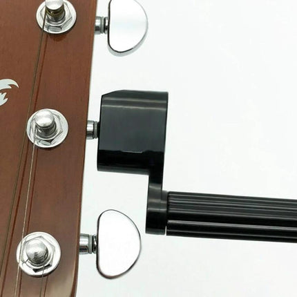 Guitar String Tool for Musicians' Daily Maintenance shown attached to guitar headstock with grooved non-slip handle and quick-turning winding mechanism