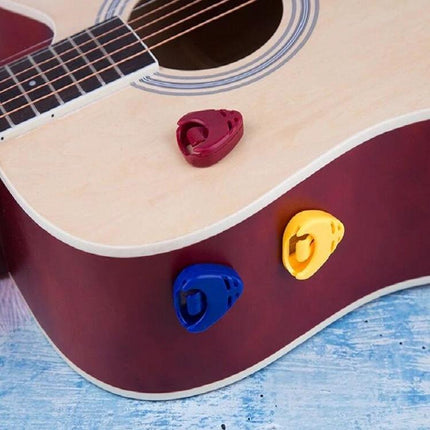 A storage box for keeping guitar picks organized in daily practice on acoustic guitar with heart and triangle pick holders (red, blue, yellow)