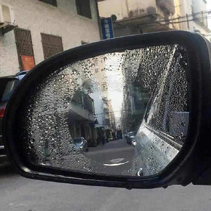 Set of 2 Rainproof Anti-Fog Films for Car Rearview Mirrors applied to wet side mirror showing clear center view and reduced fog and reflections