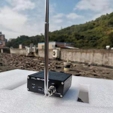 Portable Battery-Powered All-Band Radio for FM, AM, and Shortwave placed outdoors on foam with extended telescopic antenna and 1200mAh battery