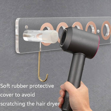 Punch Free Acrylic Hair Dryer Wall Bracket For Dyson mounted on gray wall holding a Dyson hair dryer with soft rubber protective cover