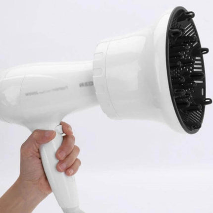 Universal Hair Diffuser For Blow Dryers, Rotatable Design attached to white hair dryer held in hand, black honeycomb vents for even airflow and reduced frizz