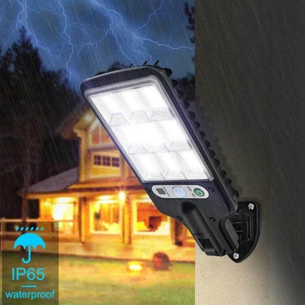 Solar Street Light With Motion Sensor For Garden Walkways mounted on wall in rain showing bright motion-activated LEDs and IP65 waterproof rating