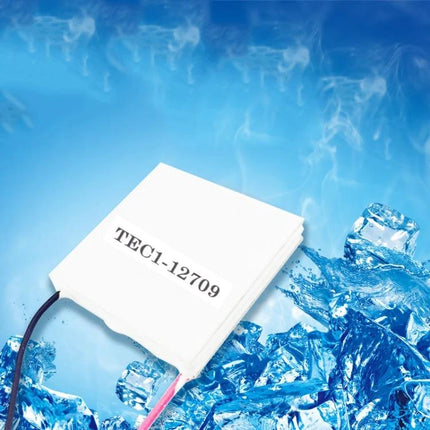 Thermoelectric Peltier Cooling Module for Electronic Projects white TEC1-12709 module on ice background for DIY cooling