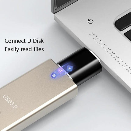 USB Adapter for Everyday Device Connections at Home plugged into laptop Type-C port reading files from USB drive