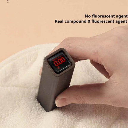 Hot And Cold Compress Facial Mask Towel With Three Holes And Straps on soft breathable fabric being tested with meter