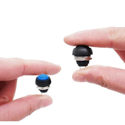 Small Waterproof Self-Reset Button Switches in Assorted Colors, 10 Pack showing two 12mm waterproof push button switches held between fingers