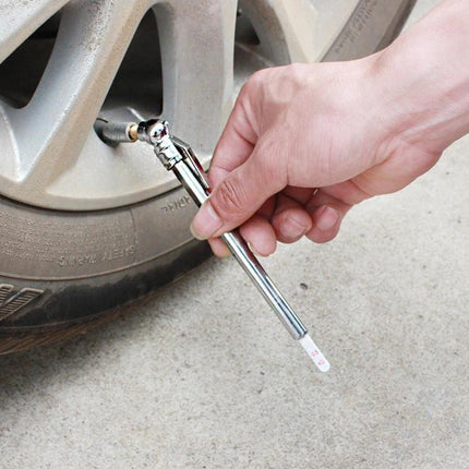 Compact Tire Pressure Gauge for Daily Car Checks on the Road - hand-held gauge checking tire valve at roadside
