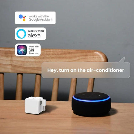 Fingerbot-01 Bluetooth Device for Automated Button Pressing on table next to smart speaker showing voice control with Google Assistant, Alexa, Siri