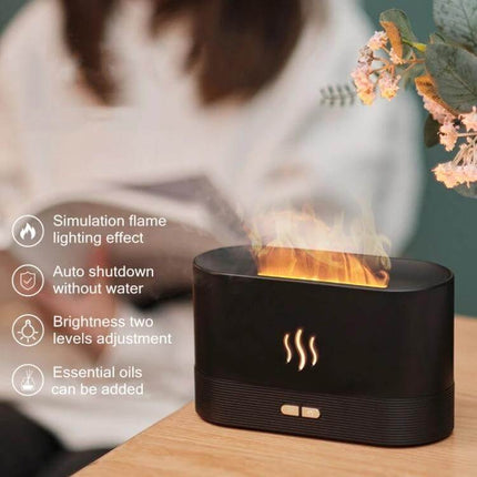 Flame Aroma Diffuser Night Light Humidifier White For Home Use on a nightstand showing simulated flame light and mist