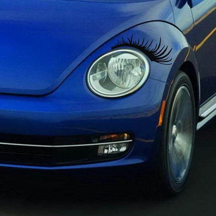 Decorative Car Eyelash Stickers for Headlights, 25x11 cm Per Pair on blue car headlight showing black PVC eyelash decal