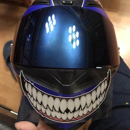 Motorcycle Helmet Decorative Stickers with Teeth Designs showing wide toothy grin on black and blue full-face helmet
