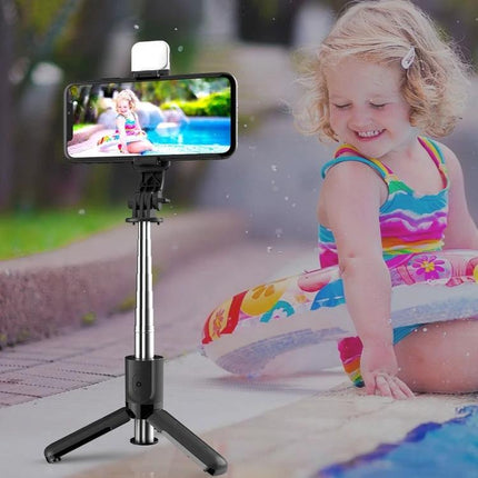 CYKE Bluetooth Selfie Stick for Travel and Daily Photos capturing a child at poolside with phone mounted on extended tripod