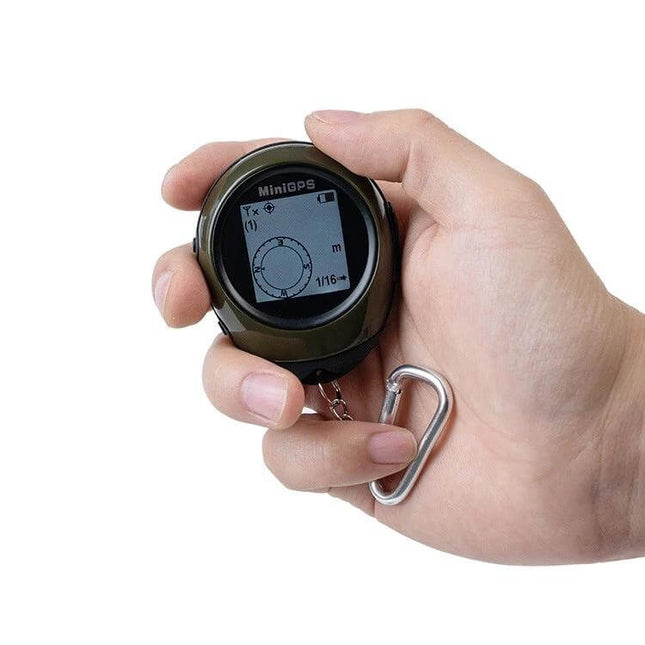 Compact GPS Locator and Compass for Outdoor Navigation and Climbing held in hand showing digital compass display and carabiner