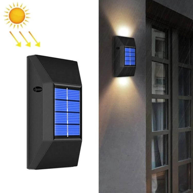Outdoor Decorative Waterproof Solar Wall Light 6 LEDs Warm Light mounted on exterior wall illuminating walkway with blue solar panel
