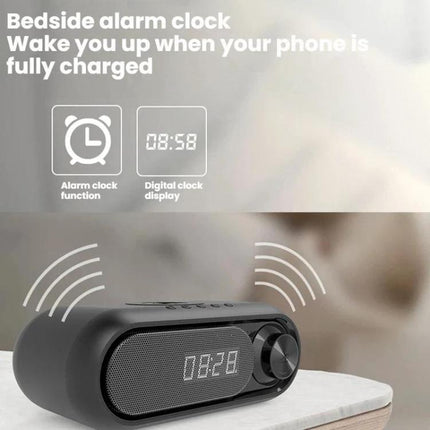 Compact Bluetooth Speaker With LED Clock And USB Charger shown on bedside table with digital clock display and alarm