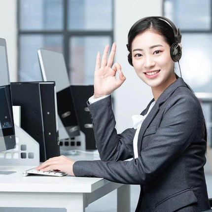 Soyto Computer Headset Black Over-Ear For Online Classes headset on smiling woman in office for remote meetings