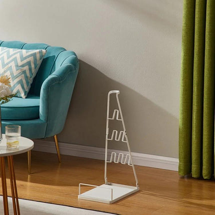 No-Drill Wall-Mounted Storage Bracket for Dyson Vacuums shown freestanding beside sofa for tidy vacuum storage