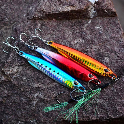 Simulation Metal Sea Fishing Bait 10g For Saltwater Anglers - 10g reflective metal lure on rock with treble hooks for night trolling and reef fishing