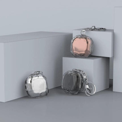 Convenient Case for Protecting Samsung Earbuds in Daily Use - clear 360-degree protective keychain case shown in silver, black and rose gold