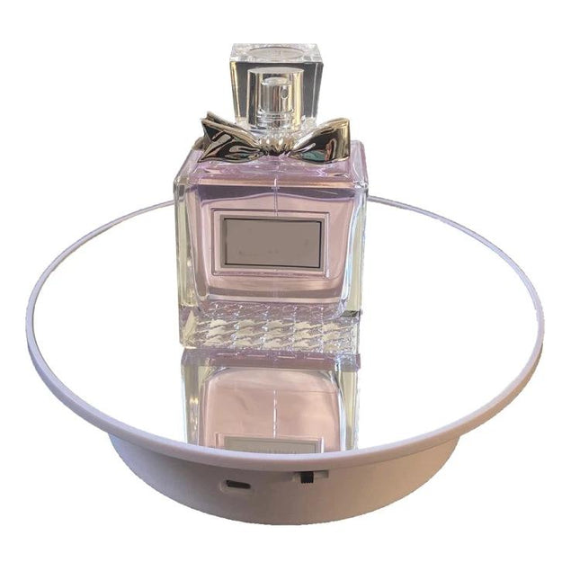 20cm Two-Way Turntable Stand for Product Display and Video Shooting showing perfume bottle on rotating mirrored platform