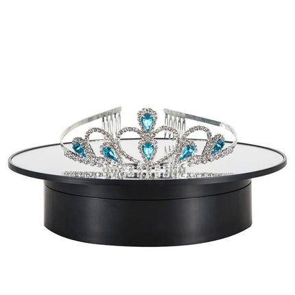 20cm Two-Way Turntable Stand for Product Display and Video Shooting showing a mirrored platform rotating a jeweled tiara for 360° product photography