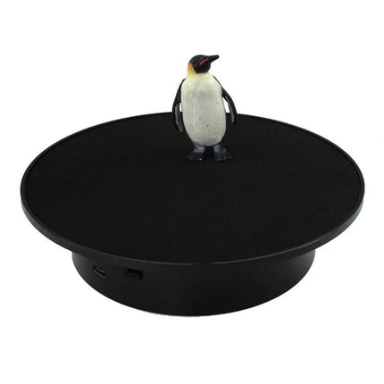 20cm Two-Way Turntable Stand for Product Display and Video Shooting showing small penguin figure on black rotating display platform