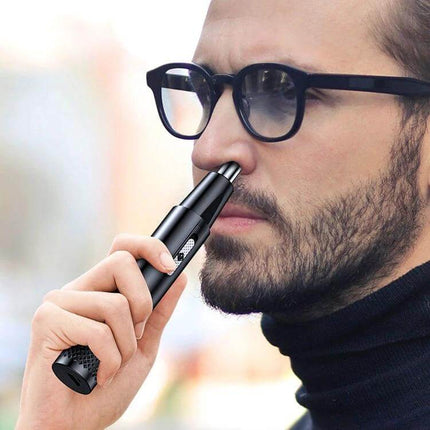 Nose Hair Trimmer For Unisex Use, USB Rechargeable Mini Clipper being used by a man for precise 360-degree nose hair trimming