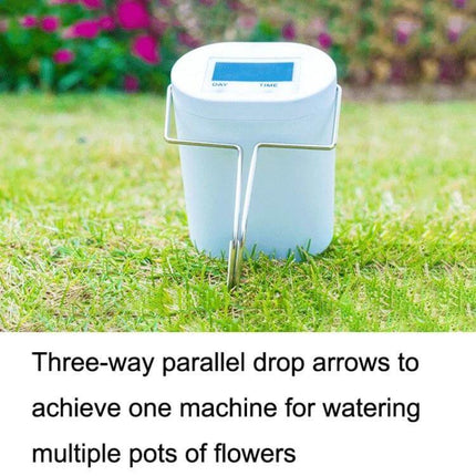 Gardening Intelligent Automatic Flower Watering Machine Two Nozzle placed on grass with digital timer and two-sprinkler heads for balcony and desk plant care