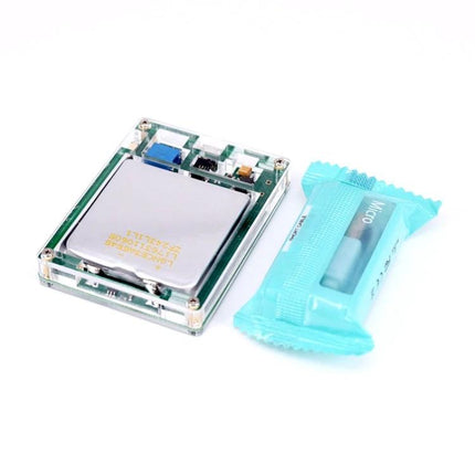 Schumann Resonance Pulse Generator for Daily Audio Enhancement compact device with clear acrylic case beside a small blue packaged accessory