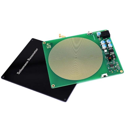 Schumann Resonator Device for Daily Relaxation and Wellness on table, green circuit board with concentric coil and black cover