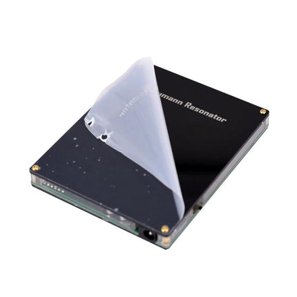 Schumann Resonator Device for Daily Relaxation and Wellness on a desk, black compact resonator for home relaxation and focus