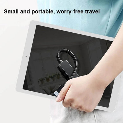 Compact Four-Port USB Hub for Connecting Devices Daily - compact portable hub shown held with tablet, four USB ports to reduce cable clutter