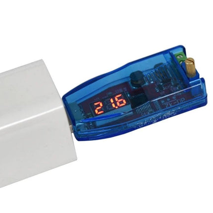 Adjustable USB Power Supply Regulator for Electronic Devices showing digital voltage display and clear blue casing connected to USB adapter