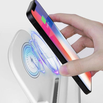15W Loudspeaker Wireless Charge Stand For 4.5 To 11 Inch Phones And Tablets showing phone charging vertically with hand placing device on stand