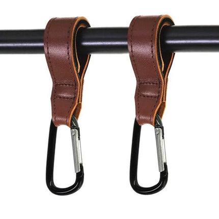 Two Pack Baby Stroller Carabiner Hooks, Brown and Black hanging from stroller bar, leather strap with black carabiners for bags and bottles